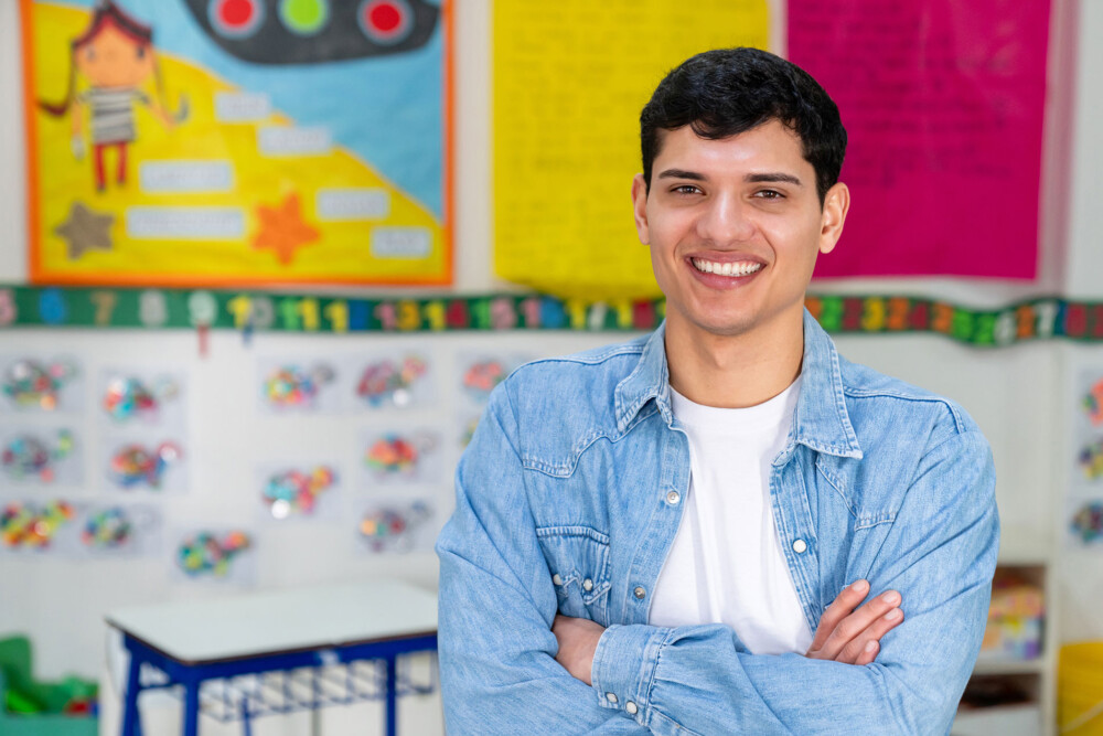 man in business casual shirt smiling